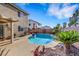 Inviting backyard pool, perfect for relaxation, with well maintained perimeter landscaping and a privacy fence at 1068 African Eagle Ave, Henderson, NV 89015
