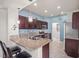 Bright kitchen boasts granite countertops, stainless appliances, and stylish pendant lighting at 10921 Grand Haven Ave, Las Vegas, NV 89134