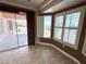 Living area featuring a sliding glass door and shutters for natural light and privacy at 10921 Grand Haven Ave, Las Vegas, NV 89134