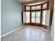 Cozy living space featuring large windows with plantation shutters, tile flooring, and neutral color tones at 10921 Grand Haven Ave, Las Vegas, NV 89134