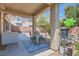 Covered patio area with seating, perfect for outdoor dining and relaxation at 11074 Caramel Crest Ct, Las Vegas, NV 89135