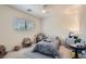 Bright bedroom features a ceiling fan, natural light, and a cozy single bed at 11074 Caramel Crest Ct, Las Vegas, NV 89135