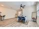 Inviting dining area featuring modern decor, a ceiling fan, and laminate flooring at 11074 Caramel Crest Ct, Las Vegas, NV 89135