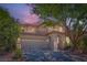 Charming two-story home features a tile roof, stucco siding, and mature landscaping in a suburban neighborhood at 11074 Caramel Crest Ct, Las Vegas, NV 89135