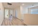 Bright hallway with hardwood floors and access to other rooms at 11074 Caramel Crest Ct, Las Vegas, NV 89135