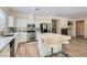 Bright, open kitchen with a center island, stainless steel appliances, and white cabinetry at 11074 Caramel Crest Ct, Las Vegas, NV 89135