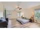 Spacious main bedroom featuring a ceiling fan and lots of natural light at 11074 Caramel Crest Ct, Las Vegas, NV 89135