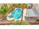 Aerial view of backyard pool with spa, covered patio, and lush landscaping at 11649 Royal Derwent Dr, Las Vegas, NV 89138