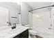 Clean, bright bathroom with tub/shower combination, black hardware, and modern fixtures at 11649 Royal Derwent Dr, Las Vegas, NV 89138