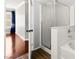 Bathroom featuring a glass-enclosed shower and a soaking tub with tile surround at 11649 Royal Derwent Dr, Las Vegas, NV 89138