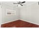 Bedroom with hardwood floors, ceiling fan, and natural light at 11649 Royal Derwent Dr, Las Vegas, NV 89138