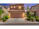 Charming two-story home with a well-maintained front yard and attached two-car garage at 11649 Royal Derwent Dr, Las Vegas, NV 89138