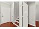 Hallway with doors and stairs; hardwood floors at 11649 Royal Derwent Dr, Las Vegas, NV 89138
