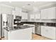 Well-equipped kitchen with stainless steel appliances and white cabinets at 11649 Royal Derwent Dr, Las Vegas, NV 89138