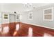 Bright and airy living room features ample natural light and beautiful hardwood flooring at 11649 Royal Derwent Dr, Las Vegas, NV 89138