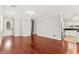 Open-concept living room with wood floors and a view of the kitchen at 11649 Royal Derwent Dr, Las Vegas, NV 89138