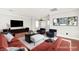 Virtually staged living room featuring hardwood floors, modern furniture, and stylish décor at 11649 Royal Derwent Dr, Las Vegas, NV 89138