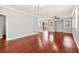 Spacious living room boasts sleek hardwood floors and a seamless flow to the dining and kitchen areas at 11649 Royal Derwent Dr, Las Vegas, NV 89138