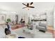 Open-concept living area featuring modern furnishings, natural light, and hardwood flooring at 11649 Royal Derwent Dr, Las Vegas, NV 89138