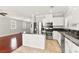 Spacious kitchen with island opens up to living room, hardwood floors at 11649 Royal Derwent Dr, Las Vegas, NV 89138