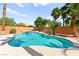 Gorgeous pool featuring a waterfall feature, lush landscaping, and a serene oasis at 11649 Royal Derwent Dr, Las Vegas, NV 89138