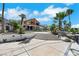 Expansive backyard with mature trees, lush greenery, and views provides a private oasis for outdoor enjoyment at 1385 Morning Sun Way, Las Vegas, NV 89110