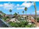 Spacious backyard featuring a luxurious pool, palm trees, and manicured landscaping at 1385 Morning Sun Way, Las Vegas, NV 89110