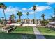 Lush backyard with a walkway, picnic table, and beautiful landscaping at 1385 Morning Sun Way, Las Vegas, NV 89110