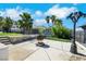 Spacious backyard featuring a barbecue area and mature palm trees, perfect for outdoor entertaining at 1385 Morning Sun Way, Las Vegas, NV 89110