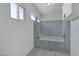 Bathroom featuring white marble walk-in tub with glass door at 1385 Morning Sun Way, Las Vegas, NV 89110