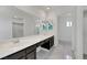Bathroom features marble floors, a double sink vanity, and large mirror at 1385 Morning Sun Way, Las Vegas, NV 89110