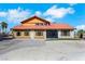 Spacious home with a double-door entrance, expansive parking, and a red tile roof, perfect for comfortable living at 1385 Morning Sun Way, Las Vegas, NV 89110