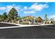 Beautiful home featuring a well-maintained yard, secure wrought iron fence, and a tranquil residential street at 1385 Morning Sun Way, Las Vegas, NV 89110