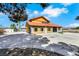 Large home featuring a circular driveway, spacious lot, and a secure gated entrance, offering privacy and curb appeal at 1385 Morning Sun Way, Las Vegas, NV 89110