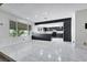 Open-concept kitchen featuring stainless steel appliances and an eat-in bar at 1385 Morning Sun Way, Las Vegas, NV 89110