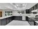 Stylish kitchen features dark cabinets, granite countertops, and stainless steel appliances at 1385 Morning Sun Way, Las Vegas, NV 89110