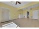 Open living room featuring tile flooring and a ceiling fan, providing comfort and style at 1385 Morning Sun Way, Las Vegas, NV 89110