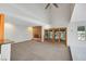 Spacious living room with a brick fireplace and access to the backyard patio at 1385 Morning Sun Way, Las Vegas, NV 89110