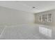 Bright, open living room features tiled floors and ample natural light from a large window at 1385 Morning Sun Way, Las Vegas, NV 89110