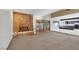 Open-concept living room with brick fireplace that leads to the kitchen and backyard at 1385 Morning Sun Way, Las Vegas, NV 89110