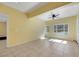 Bright living room with large windows offering plenty of natural light and a ceiling fan at 1385 Morning Sun Way, Las Vegas, NV 89110