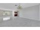 Expansive living room with tiled floors, a chandelier, and views to the outside at 1385 Morning Sun Way, Las Vegas, NV 89110
