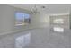 Sun-filled living room featuring bright windows, a chandelier, and tiled floors at 1385 Morning Sun Way, Las Vegas, NV 89110