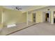 Open-concept living room with tile and carpet flooring, offering flexible design options at 1385 Morning Sun Way, Las Vegas, NV 89110