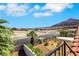 Neighborhood street view featuring lush landscaping and mountain backdrop at 1385 Morning Sun Way, Las Vegas, NV 89110