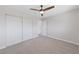 Comfortable bedroom with ceiling fan and large closet, providing ample space and storage at 1511 Irene Dr, Boulder City, NV 89005
