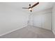 Cozy bedroom featuring a ceiling fan, closet, and neutral carpet, creating a relaxing retreat at 1511 Irene Dr, Boulder City, NV 89005