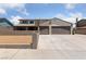 Charming two-story home with a well-manicured lawn and a spacious three car driveway at 1511 Irene Dr, Boulder City, NV 89005
