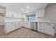 A well-lit kitchen featuring stainless steel appliances, new cabinetry and countertop space at 1511 Irene Dr, Boulder City, NV 89005