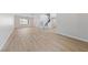 Bright living room featuring sleek flooring, staircase, and updated lighting fixture at 1511 Irene Dr, Boulder City, NV 89005